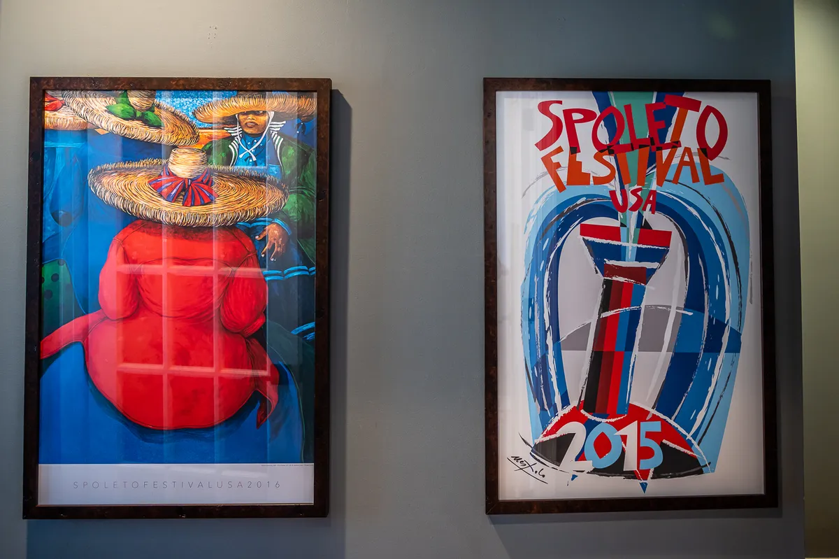 This image features colorful artwork that reflects cultural festival themes, possibly created by local artists. The display radiates a celebratory and vibrant mood, encouraging art appreciation and storytelling.